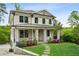 Beautiful two-story home featuring stone accents, black-framed windows, and a covered front porch at 2193 Virginia Ne Pl, Atlanta, GA 30305