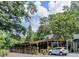 Charming building with a covered patio, surrounded by lush trees and ample parking at 2193 Virginia Ne Pl, Atlanta, GA 30305
