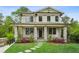 Charming two-story home with stone accents, a manicured lawn, and a welcoming front porch at 2193 Virginia Ne Pl, Atlanta, GA 30305