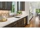 Gourmet kitchen with a wine fridge, stone backsplash, and bright countertops at 2193 Virginia Ne Pl, Atlanta, GA 30305