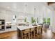 Bright, open-concept kitchen with white cabinetry, large island, and stainless steel appliances at 2193 Virginia Ne Pl, Atlanta, GA 30305
