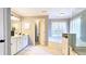 Bright bathroom with a soaking tub, shower, and white cabinets at 2227 Austin Lake Se Dr, Smyrna, GA 30082