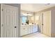 Bathroom featuring white cabinets, double sinks, and neutral walls at 2227 Austin Lake Se Dr, Smyrna, GA 30082