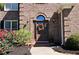 Welcoming front entrance showcasing a brick facade, decorative wreath, and well-maintained landscaping at 2227 Austin Lake Se Dr, Smyrna, GA 30082