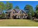 Beautiful brick home with a well-manicured lawn and lush landscaping creates great curb appeal at 2227 Austin Lake Se Dr, Smyrna, GA 30082