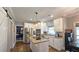 Spacious kitchen with stainless steel appliances, granite counters, and access to the dining area at 2227 Austin Lake Se Dr, Smyrna, GA 30082