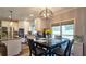 Bright eat-in kitchen featuring white cabinets, stainless steel appliances, and stylish modern lighting at 2227 Austin Lake Se Dr, Smyrna, GA 30082