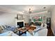Bright living room showcases fireplace, with an open layout and hardwood flooring at 2227 Austin Lake Se Dr, Smyrna, GA 30082