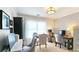 Bright home office with modern lighting, a neutral palette, and large window views of the neighborhood at 2227 Austin Lake Se Dr, Smyrna, GA 30082