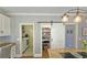 Walk-in pantry with a sliding barn door, with convenient access to the kitchen and laundry room at 2227 Austin Lake Se Dr, Smyrna, GA 30082