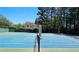 Outdoor tennis courts offer an active lifestyle, well-maintained with lush landscaping and privacy at 2227 Austin Lake Se Dr, Smyrna, GA 30082