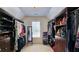 Large walk-in closet with custom shelves and cabinets, offering ample storage space at 2227 Austin Lake Se Dr, Smyrna, GA 30082