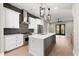 Well-appointed kitchen featuring stainless appliances, white cabinets, unique backsplash and gray kitchen island at 2333 Mason Dr # D26, Atlanta, GA 30316