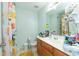Clean bathroom with sink, toilet, and shower featuring fall-themed decorative curtain at 275 Fern Crest Dr, Lawrenceville, GA 30046