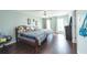Bright bedroom with hardwood floors, two windows, and a comfy bed at 275 Fern Crest Dr, Lawrenceville, GA 30046
