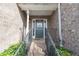 Inviting front porch with brick stairs, black iron railing, and a well-lit entryway at 275 Fern Crest Dr, Lawrenceville, GA 30046