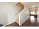 Hallway features hardwood floors, staircase, and neutral paint tones at 275 Fern Crest Dr, Lawrenceville, GA 30046