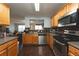 Well-equipped kitchen with stainless steel appliances, wooden cabinetry, and hardwood floors at 275 Fern Crest Dr, Lawrenceville, GA 30046