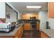 Functional kitchen features stainless steel appliances, ample counter space, and dark hardwood floors at 275 Fern Crest Dr, Lawrenceville, GA 30046
