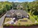 Expansive aerial view of the property highlighting the manicured lawn, outdoor living spaces, and lush surroundings at 3920 Maybreeze Rd, Marietta, GA 30066