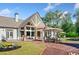 Stunning backyard with an expansive patio, outdoor dining, lush landscaping, and inviting seating areas at 3920 Maybreeze Rd, Marietta, GA 30066