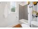 Bright bathroom featuring a fun printed shower curtain and stylish black and white patterned tile at 3920 Maybreeze Rd, Marietta, GA 30066