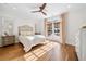 Bright bedroom with white walls, wood floors, and french doors at 3920 Maybreeze Rd, Marietta, GA 30066