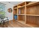 Walk-in closet with custom wood shelving and a window at 3920 Maybreeze Rd, Marietta, GA 30066