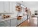 Well-appointed kitchen featuring custom cabinets, copper sink, and modern appliances at 3920 Maybreeze Rd, Marietta, GA 30066