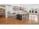 Sun-filled kitchen and dining area with custom cabinets and modern appliances at 3920 Maybreeze Rd, Marietta, GA 30066
