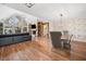 Bright living room with hardwood floors, high ceilings, fireplace, and large windows at 3920 Maybreeze Rd, Marietta, GA 30066