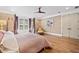Spacious main bedroom featuring hardwood floors, soft lighting, and french doors to the backyard at 3920 Maybreeze Rd, Marietta, GA 30066