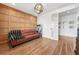 Office featuring a leather sofa, paneled accent wall, and french doors at 3920 Maybreeze Rd, Marietta, GA 30066