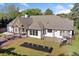 Stunning rear exterior showcasing a spacious deck and beautifully landscaped backyard, perfect for outdoor living at 3920 Maybreeze Rd, Marietta, GA 30066