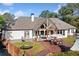 Picture of an elegant rear exterior featuring a deck and outdoor seating area for entertaining, surrounded by greenery at 3920 Maybreeze Rd, Marietta, GA 30066