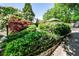 A multi-tiered garden with mature landscaping, offering a tranquil space for outdoor living and enjoying nature's beauty at 272 Rumson Ne Rd, Atlanta, GA 30305