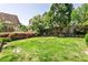 A beautifully landscaped backyard featuring a lush lawn and mature trees, creating a serene and private outdoor space at 272 Rumson Ne Rd, Atlanta, GA 30305