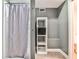 Modern bathroom includes shower, shelves, and storage at 272 Rumson Ne Rd, Atlanta, GA 30305