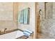 Luxurious bathroom featuring a soaking tub with marble surround and a tiled walk-in shower at 272 Rumson Ne Rd, Atlanta, GA 30305