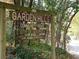 Garden Hills Community House sign, surrounded by lush greenery, showcasing the neighborhood's charm at 272 Rumson Ne Rd, Atlanta, GA 30305