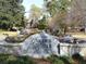 Historic Garden Hills entrance featuring a classic monument with water feature and landscaping, showcasing the neighborhood's charm at 272 Rumson Ne Rd, Atlanta, GA 30305