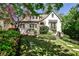 Charming home with a landscaped front yard, stone walkway, and architectural details at 272 Rumson Ne Rd, Atlanta, GA 30305