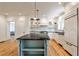 Light and bright kitchen features hardwood floors, lots of storage, modern appliances, and a gray island at 272 Rumson Ne Rd, Atlanta, GA 30305