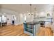 Open kitchen features hardwood floors, a gray island, modern appliances, and lots of storage at 272 Rumson Ne Rd, Atlanta, GA 30305