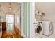 Convenient laundry area with side-by-side washer and dryer units and views into an open hallway at 272 Rumson Ne Rd, Atlanta, GA 30305
