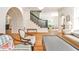 Expansive living room featuring hardwood floors, an elegant archway, staircase, and comfortable seating arrangements at 272 Rumson Ne Rd, Atlanta, GA 30305