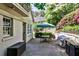 Outdoor patio with a seating area and lush landscaping at 272 Rumson Ne Rd, Atlanta, GA 30305