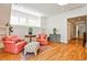 Bedroom sitting area with stylish chairs and ottoman, offering a comfortable space for reading and conversation at 272 Rumson Ne Rd, Atlanta, GA 30305