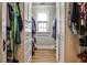 Spacious walk-in closet with custom shelving and ample storage for organizing clothes and accessories at 272 Rumson Ne Rd, Atlanta, GA 30305