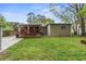 Spacious backyard featuring a deck, shed, and mature trees at 3048 Cottonwood Se Dr, Atlanta, GA 30316
